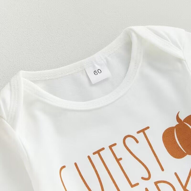 Pumpkin Three-Piece Baby Set — Neckline and print detail